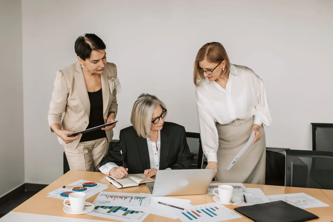Businesswomen reviewing documents during a business meeting