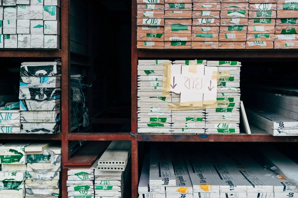 Building materials stacked on warehouse shelves — inventory financing for high-volume businesses