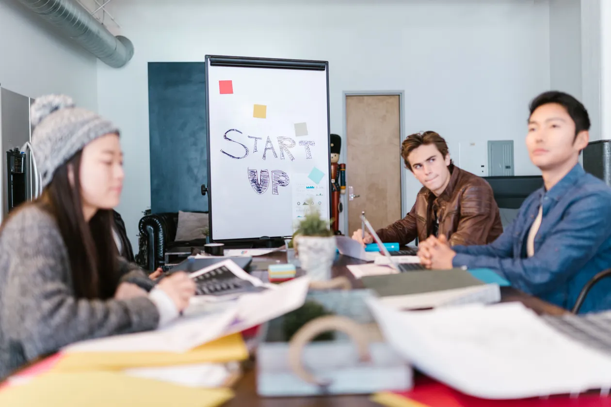 Two professionals in a business meeting discussing funding options