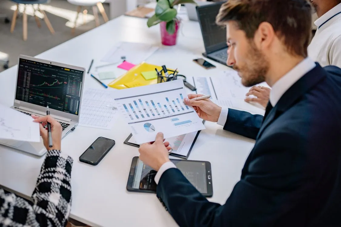Businessman reviewing graphs and data in an office